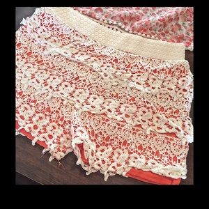 Lapis Girls crochet shorts.  Orange/salmon/pink color.
